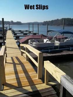 A wooden dock labeled Wet Slips with boats moored.